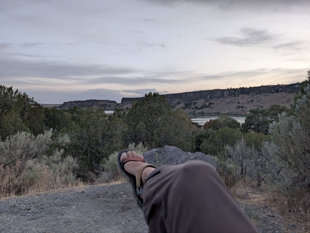 A relaxed view over the Snake River at dusk from a rocky overlook